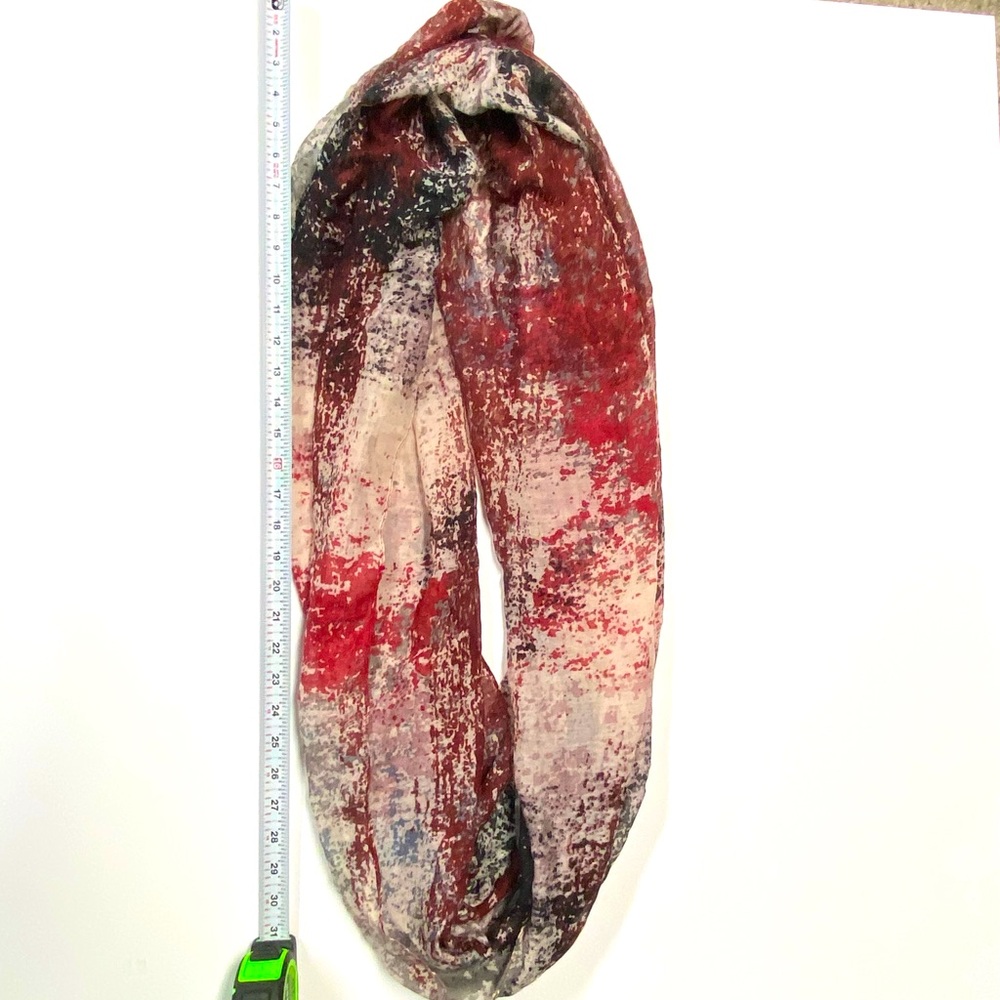 Red beige and black infinity scarf.